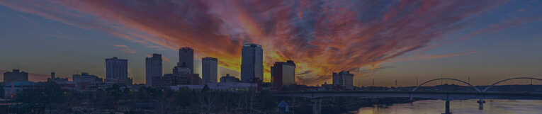 town with tall buildings at sunset