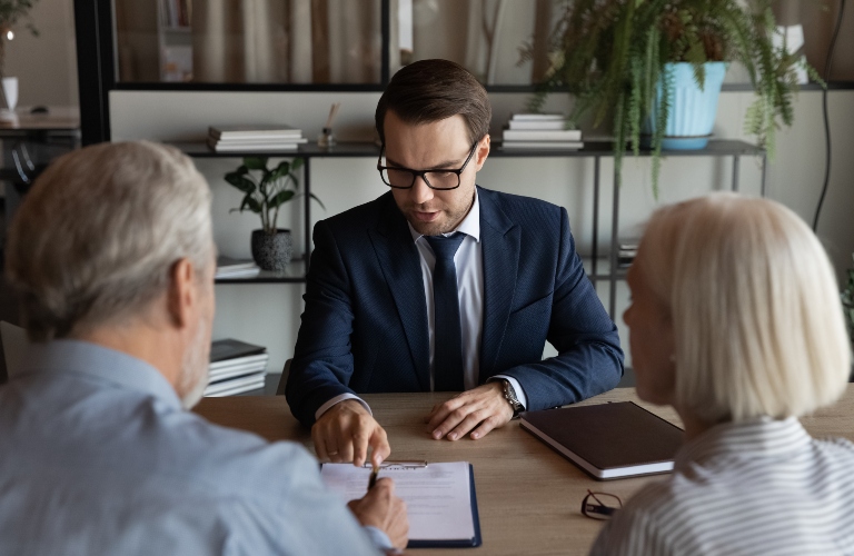 lawyer speaking with senior couple