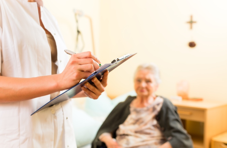 Young nurse and senior woman