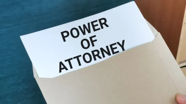 Document labeled "Power of Attorney" partially visible inside a beige envelope.